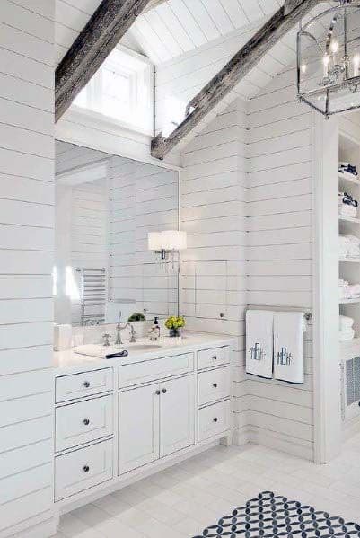 pitched white shiplap bathroom with tile floor