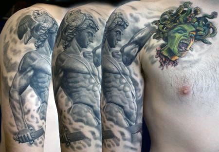 Sleeve And Upper Chest Perseus Sword With Green Medusa Snake Head Tattoo On Man