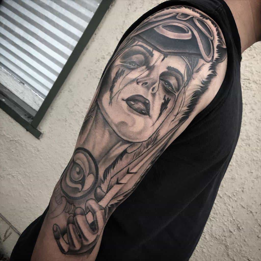 Black and grey realistic tattoo of San from Princess Mononoke, wearing her wolf mask, with intense shading and dramatic expression.