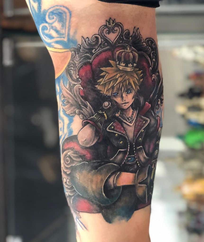 Kingdom Hearts tattoo of Sora sitting on an ornate throne wearing a crown, with deep shading and a regal, dramatic color palette.