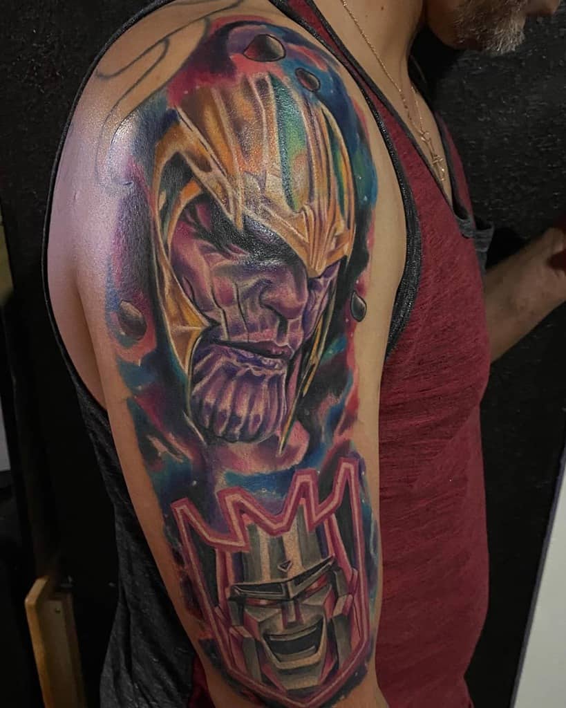 A vibrant tattoo of Thanos with a cosmic background, featuring his intense expression, and Optimus Prime's face at the bottom with bold colors