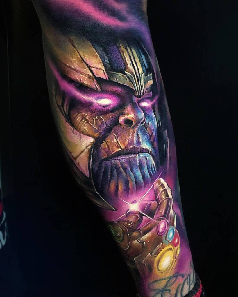 A vibrant tattoo of Thanos with glowing eyes, surrounded by purple hues, holding the Infinity Gauntlet with the Stones shining brightly