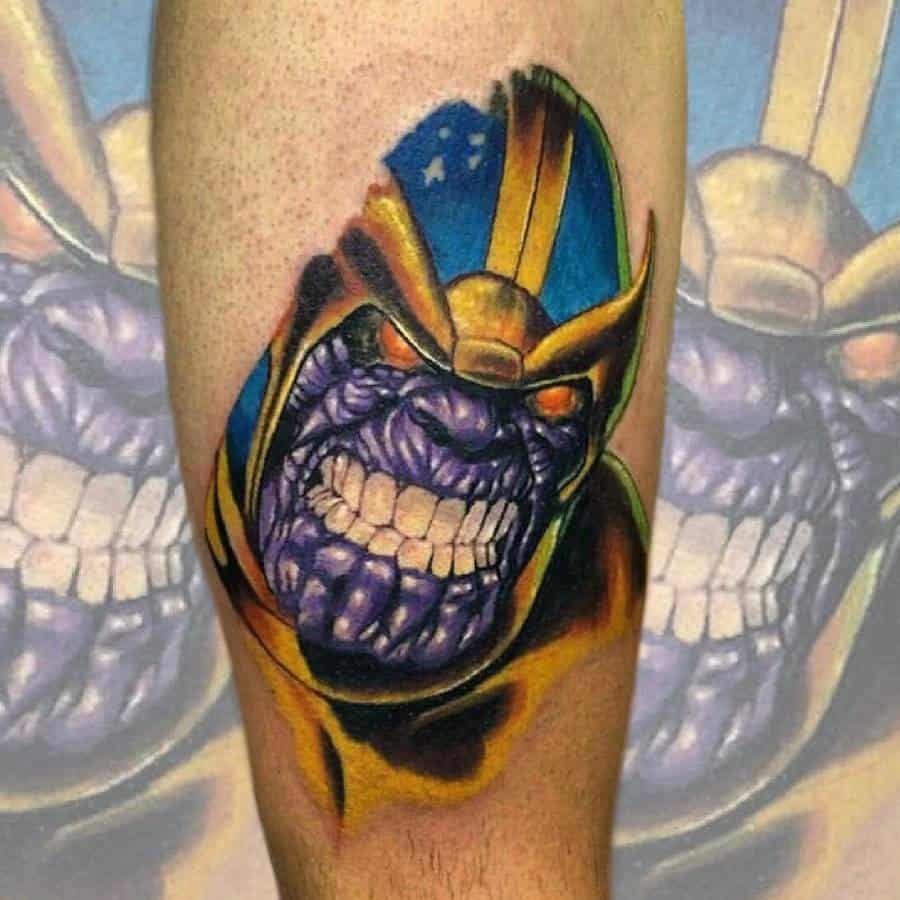A colorful tattoo of Thanos with a fierce grin, detailed purple skin, and a vibrant gold and blue helmet