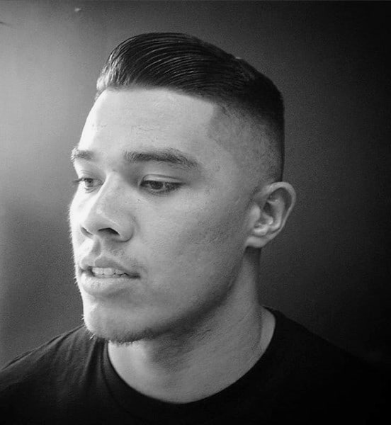 Slicked Comb Over Mens Haircut With Low Fade