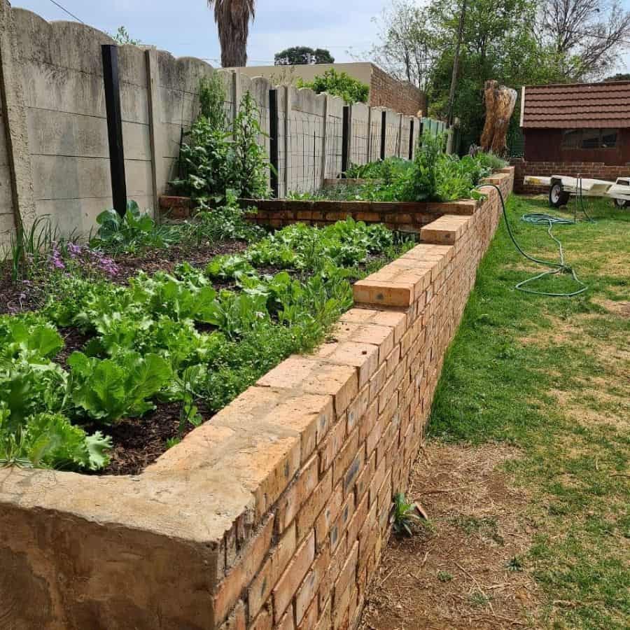 brick retaining wall backyard garden 