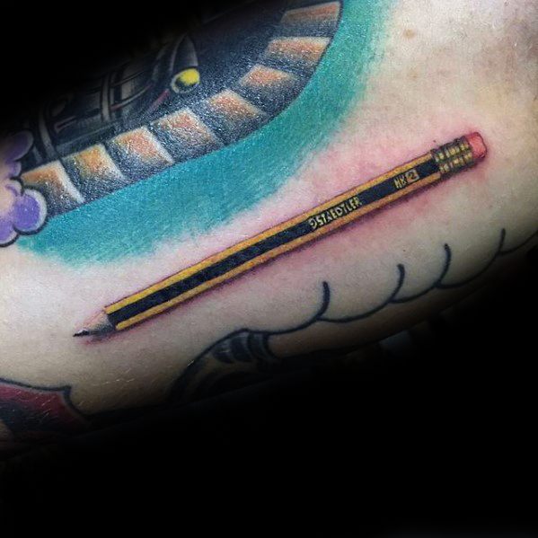 A tattoo of a realistic yellow pencil elegantly etched on skin, complete with intricate black lettering