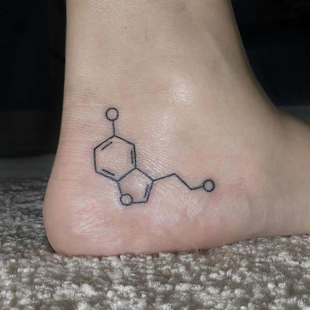 Elegant serotonin molecule tattoo on the ankle