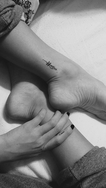 Small Unalome tattoo on the ankle, symbolizing the journey to enlightenment, personal growth, and inner peace.