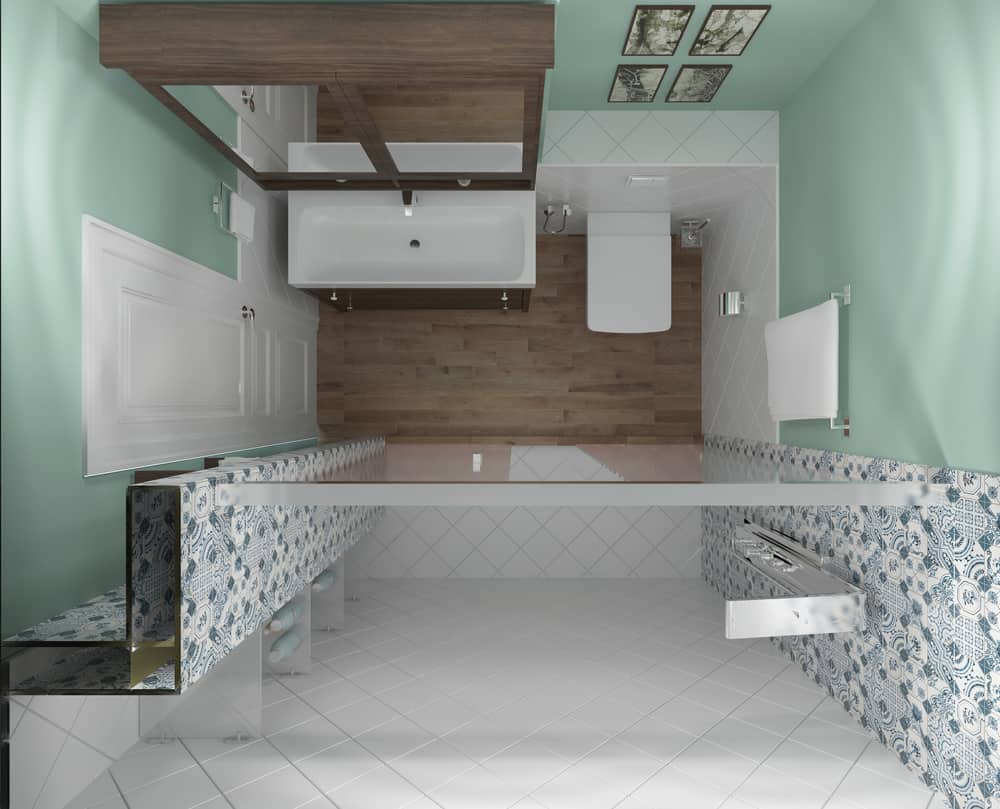 modern bathroom layout with green walls and white tile shower