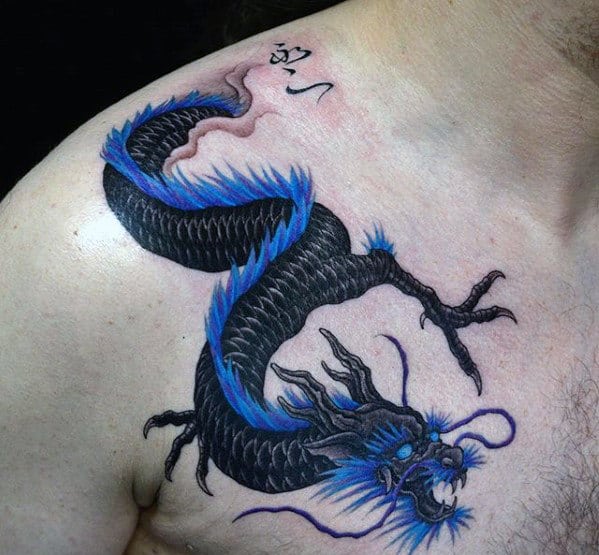 A black and blue dragon tattoo on an upper chest and shoulder