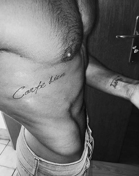 Small Carpe Diem Rib Cage Side Of Body Tatoo On Man