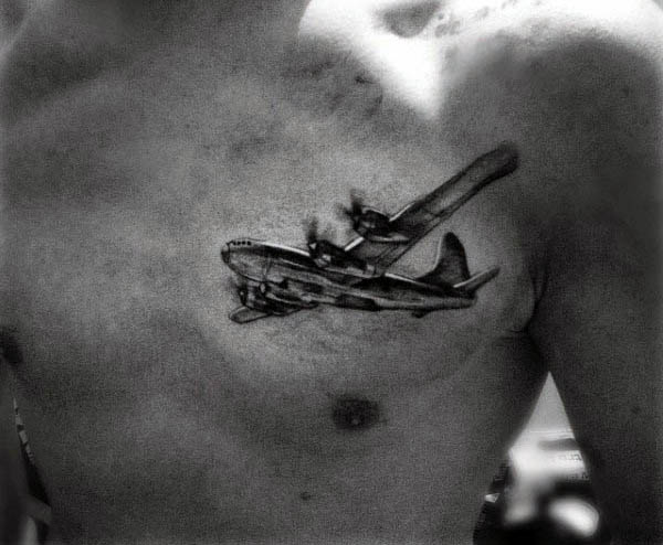 Tattoo of a vintage airplane soaring across a person's chest