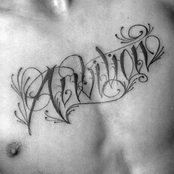 Ornate black script spells "Ambition" across a person's chest, a testament to their drive