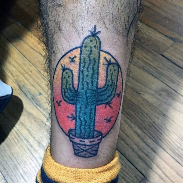 Small Circle Sunset Cactus Tattoo On Leg Of Man