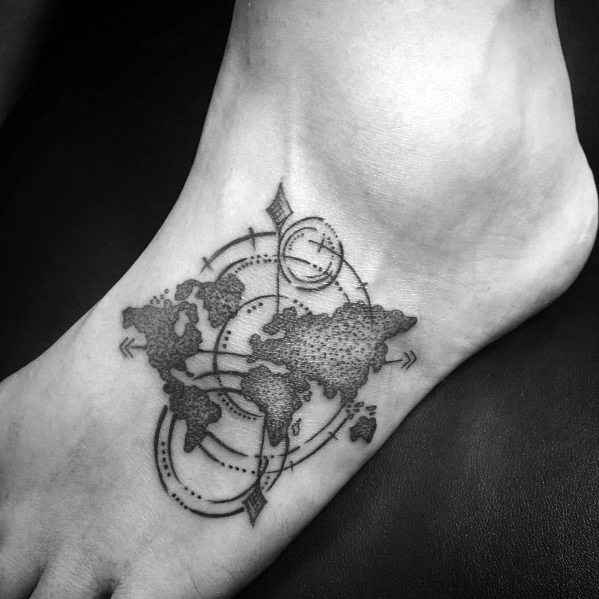 World map tattoo with fine dotwork and geometric compass details on the foot, symbolizing travel, adventure, and global exploration.