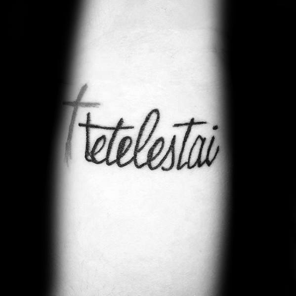 Small Cross With Tetelestai Script Male Forearm Tattoo Inspiraton
