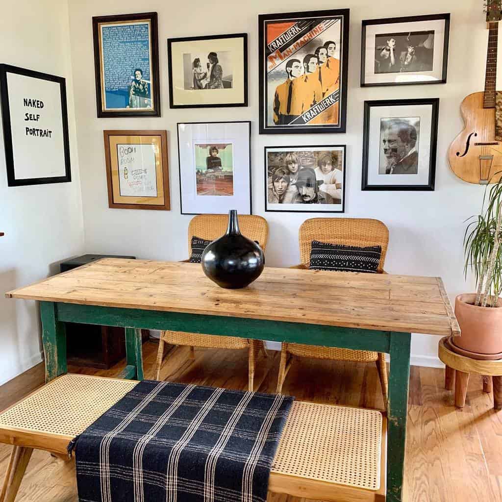 small dining room wood table wicker chairs music poser wall art