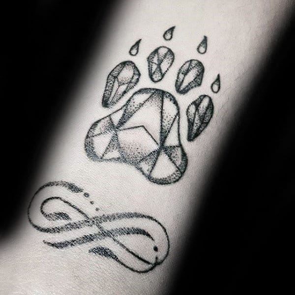 Small Dotwork Guys Dog Paw Tattoo On Forearm