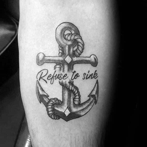 Refuse To Sink" anchor tattoo entwined with rope on skin