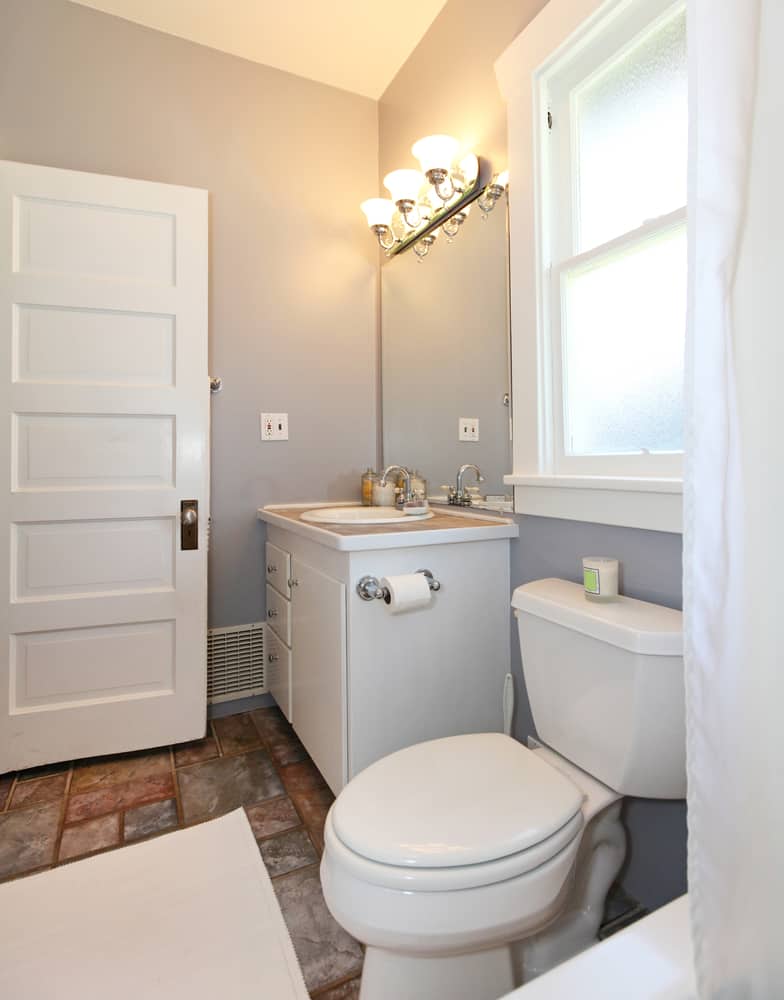 small bathroom with white vanity