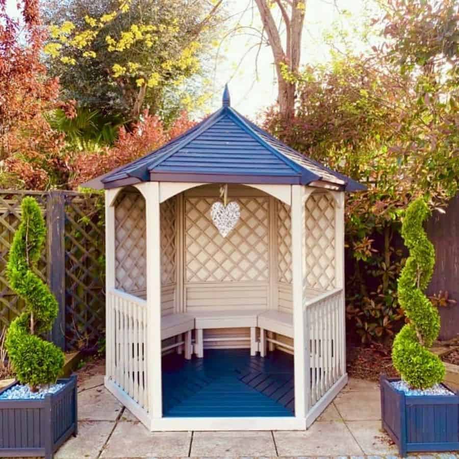 small white and blue wood gazebo backyard