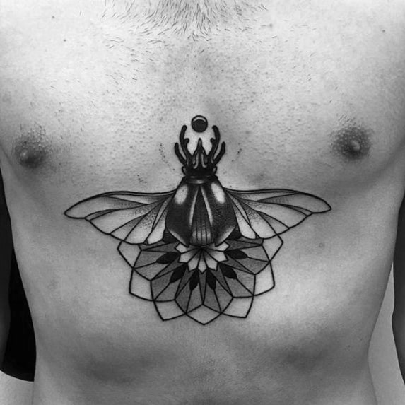 small geometric flower scarab bettle mens center of chest tattoo