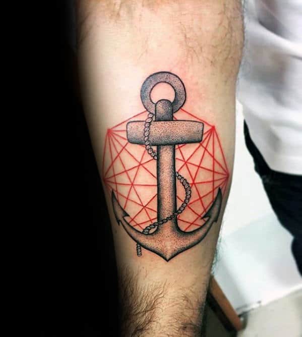 Black and gray anchor tattoo with a geometric red background and fine chain details, symbolizing stability, structure, and a modern nautical aesthetic.
