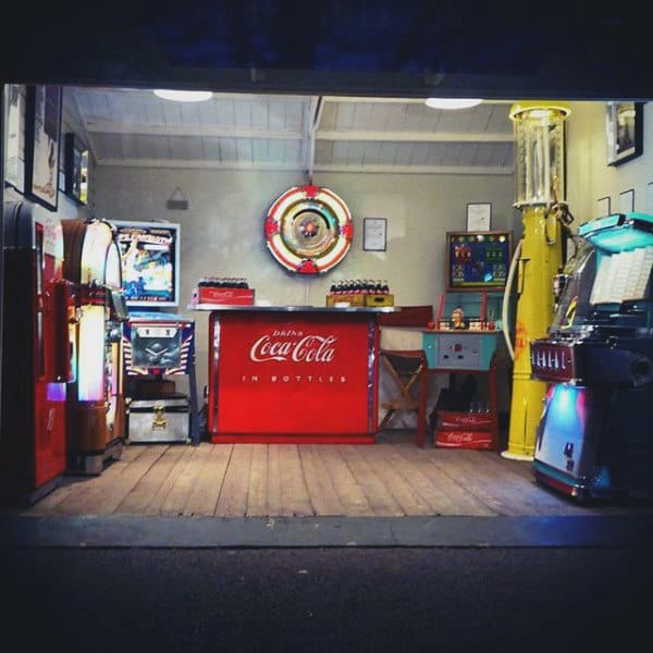 Vintage arcade with Coca-Cola decor, retro jukebox, pinball machines, and classic vending machines