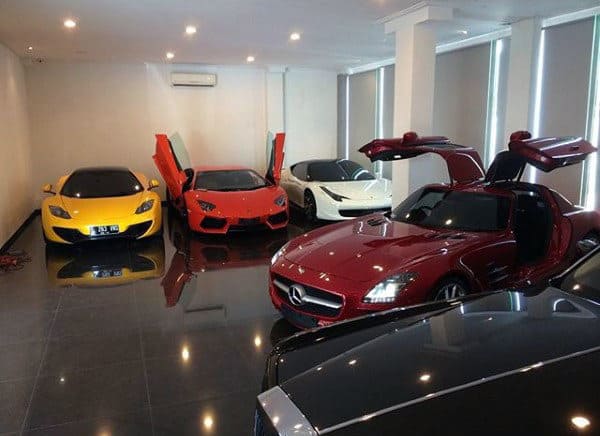 Compact dream garage showcasing exotic cars like Mercedes, Lamborghini, and McLaren with sleek flooring.