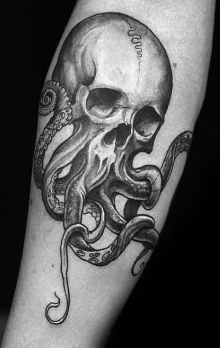Skull surrounded by octopus tentacles, with detailed shading and smooth line work, creating a bold and dynamic black-and-grey design.