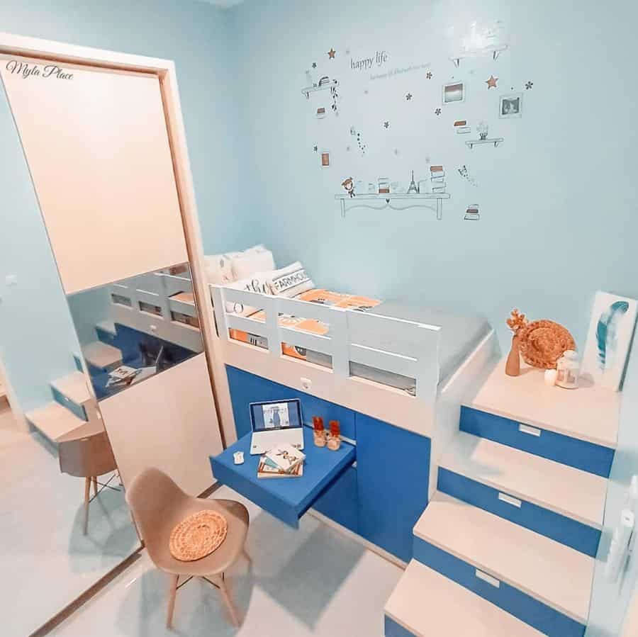 small boys bedroom elevated bed with storage space underneath wall mural