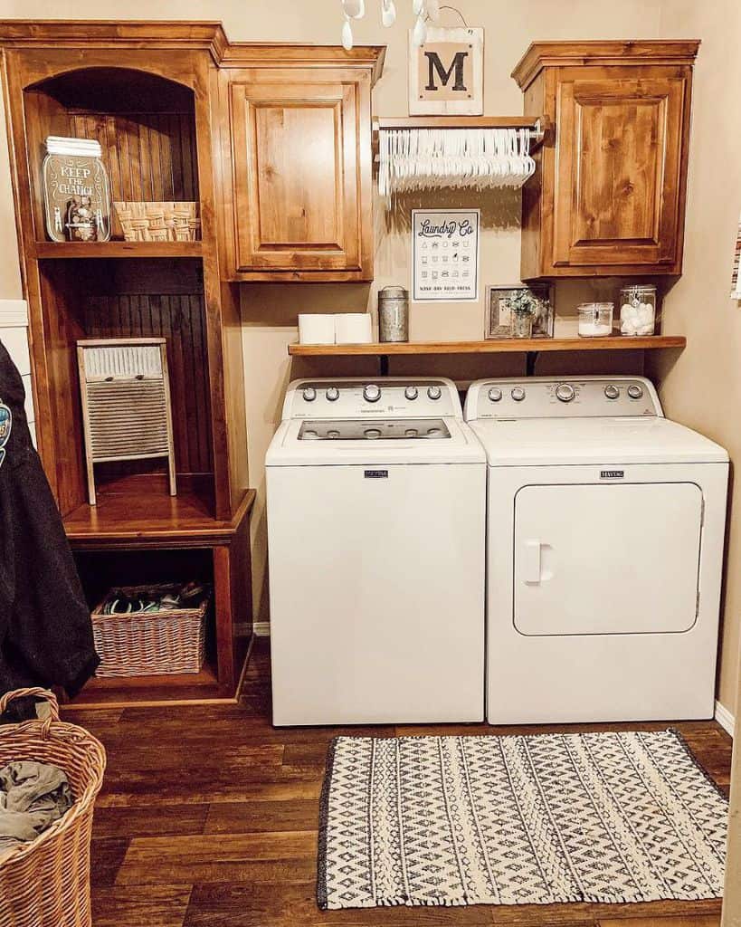 small laundry room wood cabinets washer and dryer