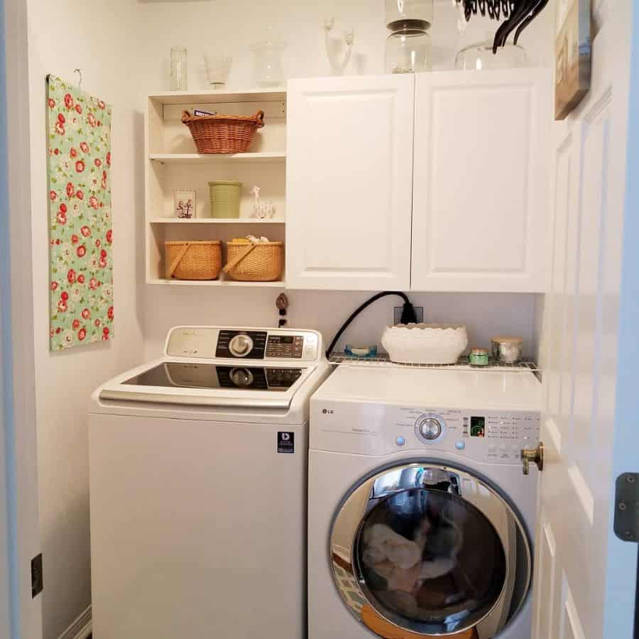 modern farmhouse laundry with white wall cabinets and shelving