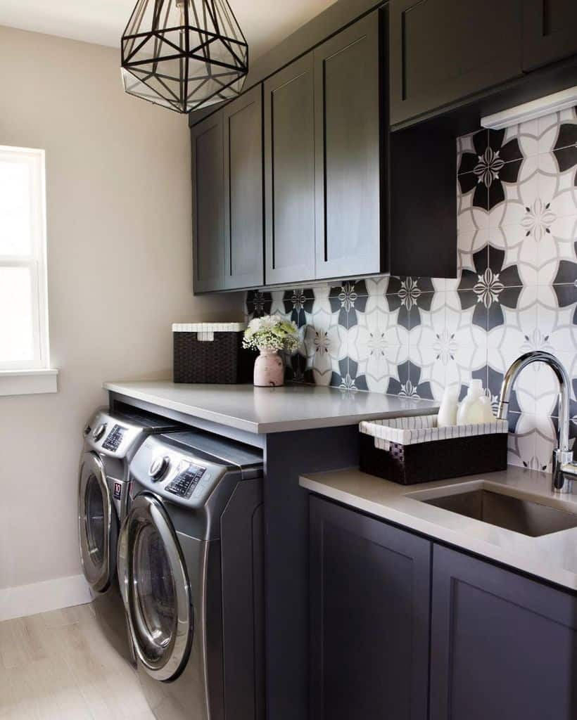 black laundry room with sink