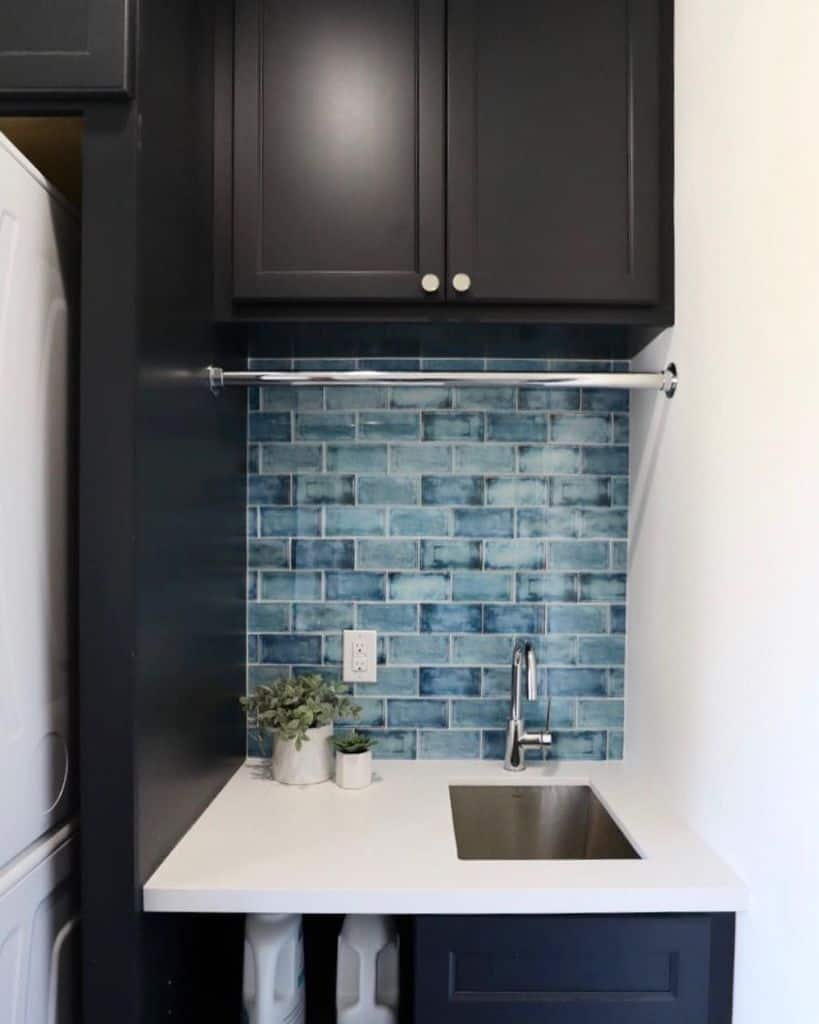 small laundry sink blue wall tiles