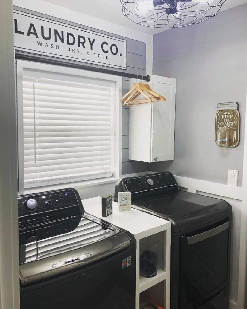 black washer and dryer in small laundry room
