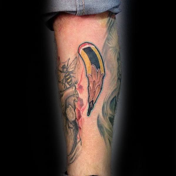 A striking tattoo of a pencil seamlessly transforms into a realistic tear cascading down a person's leg
