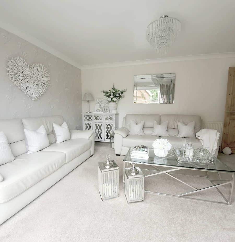 all white living room with chandelier
