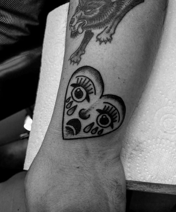 Small Male Tattoo With Crying Heart Design