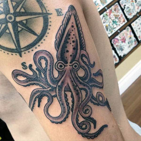 Small Mean Looking Squid Tattoo On Arm Of Man