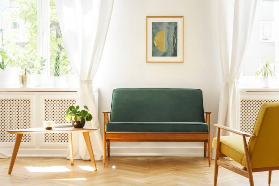 mid-century modern living room with green accent seat