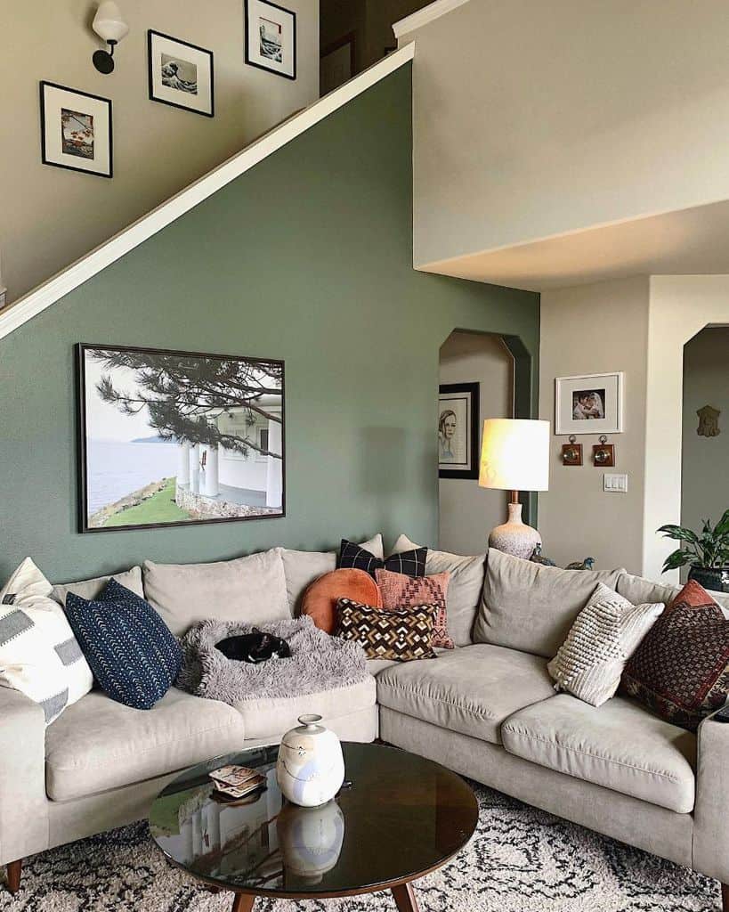 green accent wall gray l-shape sofa living room 