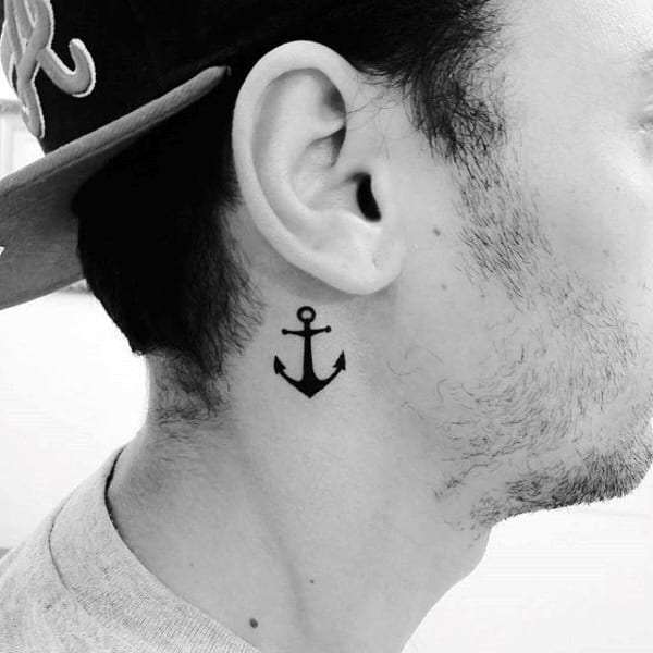 Small anchor tattoo behind the ear