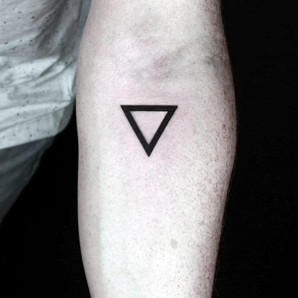 Simple black triangle tattoo on a  forearm