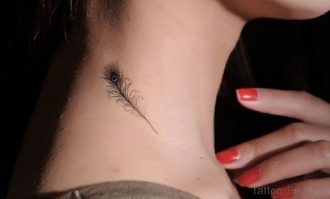 Small and delicate peacock feather tattoo on the side of the neck, featuring fine black linework with subtle detailing.