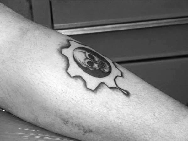 Small Negative Space Gears Of War Guys Leg Tattoo