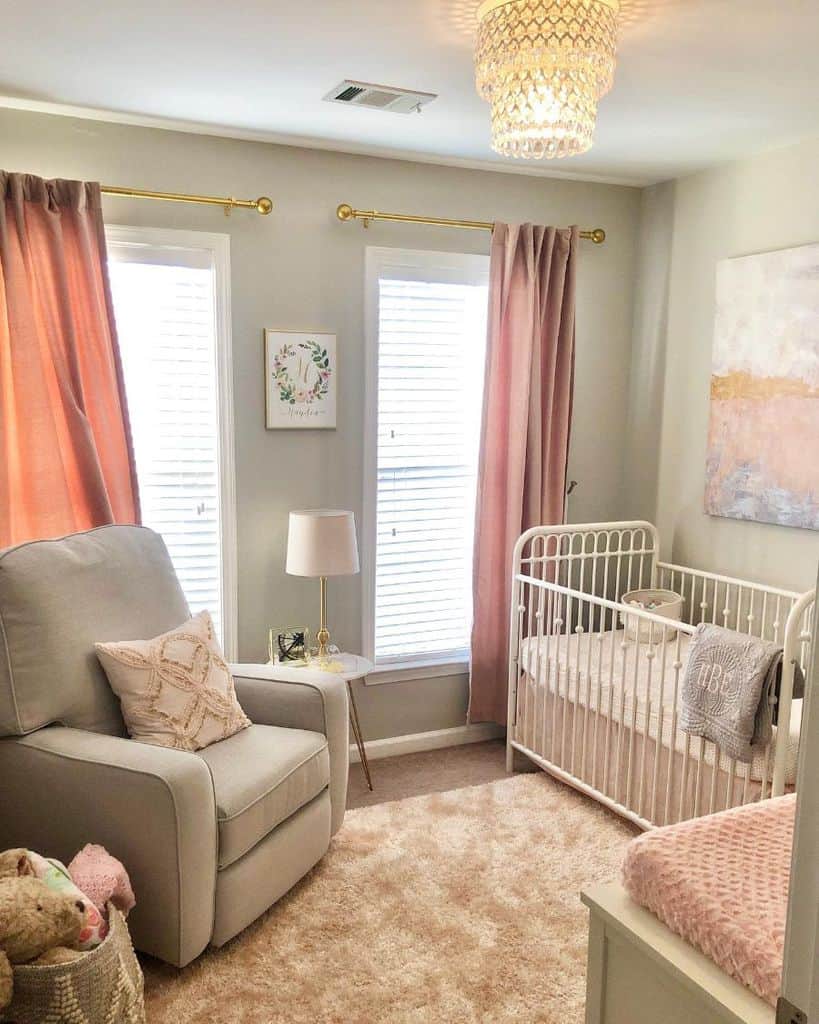 small neutral color nursery cast iron white crib gray sofa pink curtains