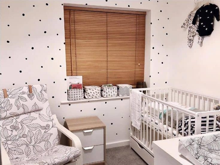 modern nursery white crib dot wall paper leaf fabric chair