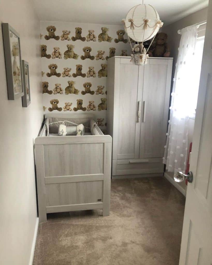 small nursery teddybear wallpaper gray crib and wardrobe