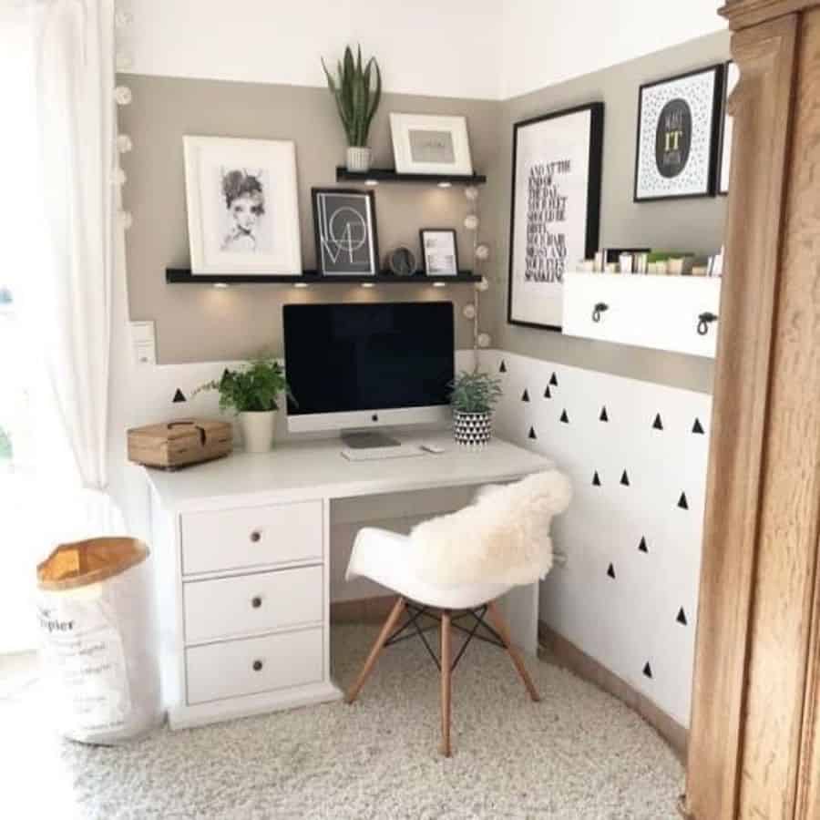 small corner office space bedroom two tone wall white desk with draws white chair framed wall art